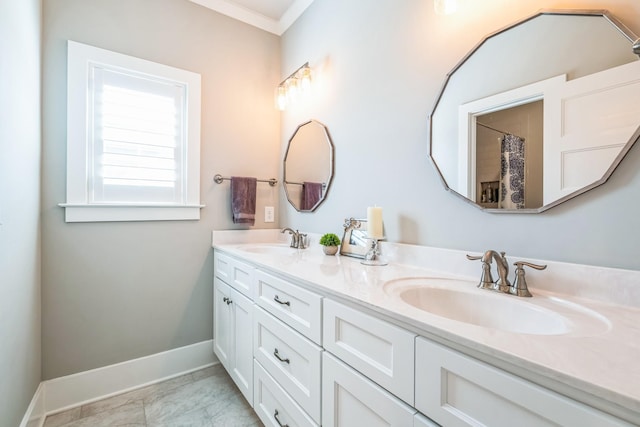 full bath with crown molding, double vanity, a sink, and baseboards