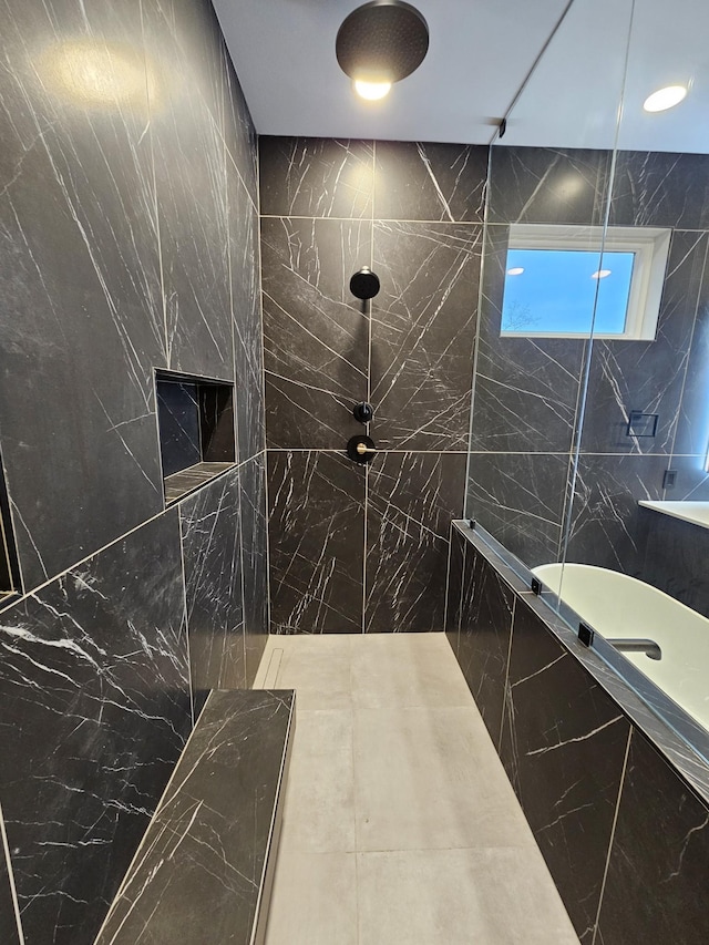 full bath with a tile shower