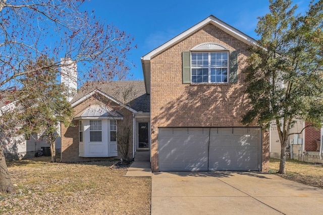 traditional-style home with driveway, an attached garage, a front lawn, and brick siding