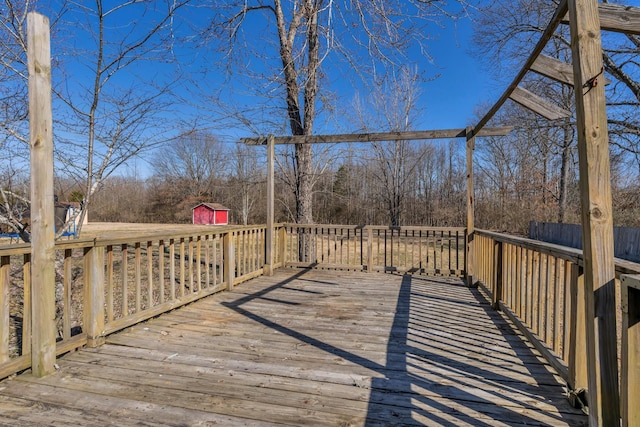 deck featuring an outbuilding and a storage shed