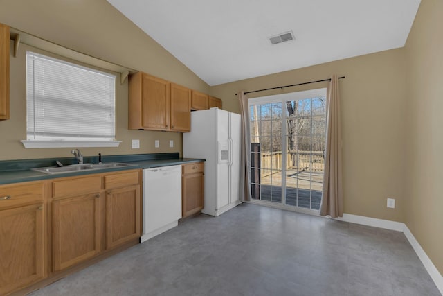 kitchen with white appliances, baseboards, visible vents, lofted ceiling, and a sink