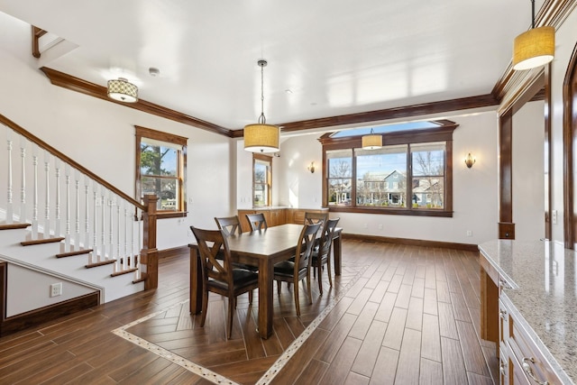 dining room with wood tiled floor, stairs, ornamental molding, and baseboards