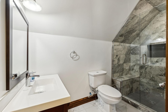 bathroom featuring marble finish floor, toilet, a stall shower, vaulted ceiling, and vanity