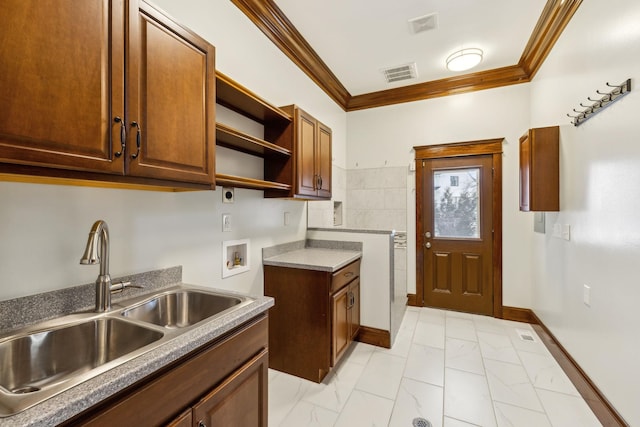 kitchen featuring crown molding, visible vents, open shelves, and a sink