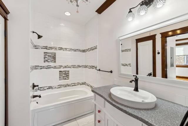 bathroom with marble finish floor, shower / washtub combination, and vanity