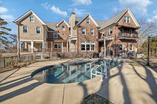 view of pool with a fenced in pool, a patio area, and fence