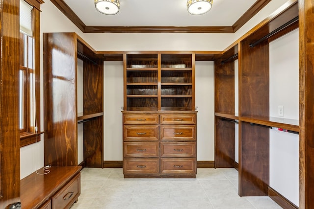 spacious closet with light tile patterned floors