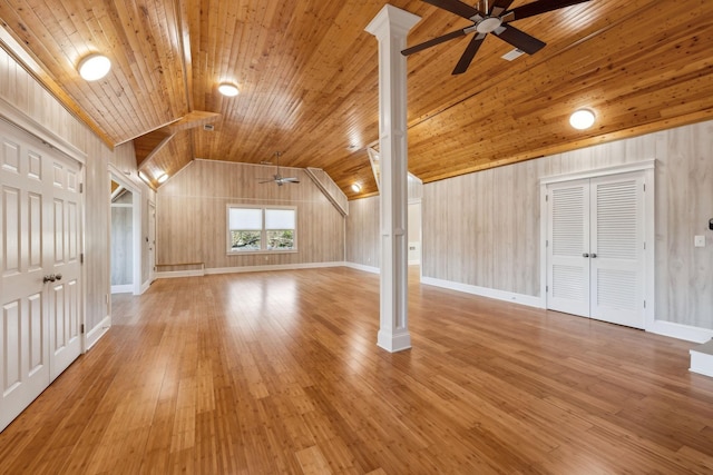 bonus room with light wood-style flooring, a ceiling fan, wood ceiling, vaulted ceiling, and baseboards