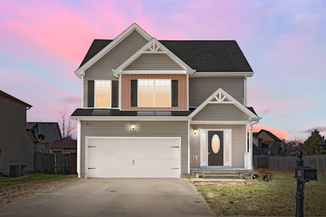 view of front facade featuring an attached garage, central air condition unit, fence, and concrete driveway