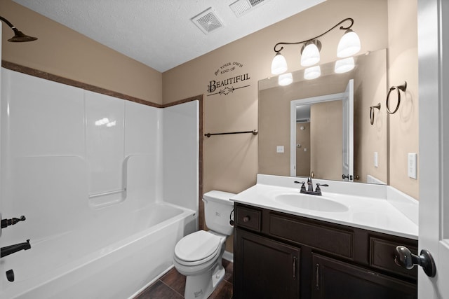 bathroom with visible vents, a textured ceiling, toilet, and vanity