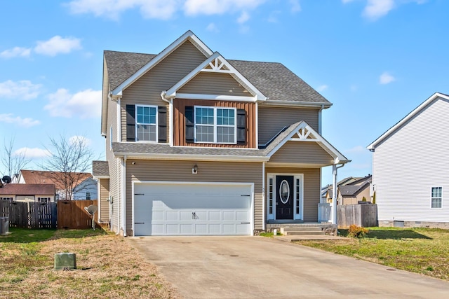 view of front of home with roof with shingles, driveway, an attached garage, and fence