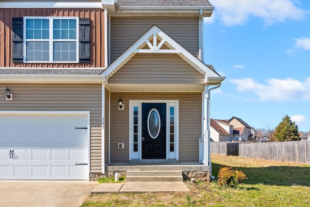 view of front of house featuring a shingled roof, fence, board and batten siding, and concrete driveway