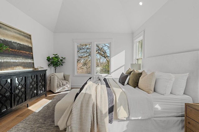 bedroom featuring lofted ceiling, recessed lighting, and wood finished floors