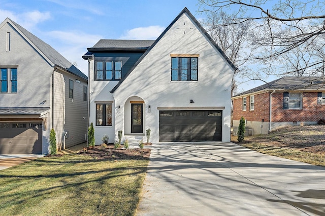 view of front facade with a garage, concrete driveway, and brick siding