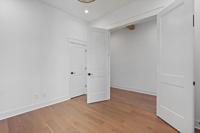 interior space featuring light wood finished floors, baseboards, and recessed lighting