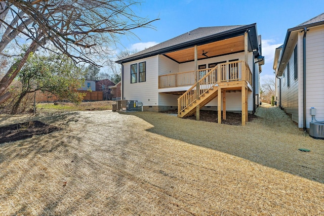 rear view of house with a ceiling fan, crawl space, fence, a deck, and stairs