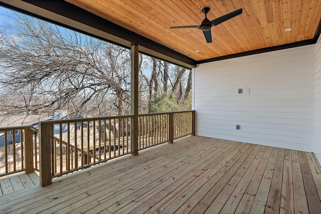 wooden terrace with a ceiling fan