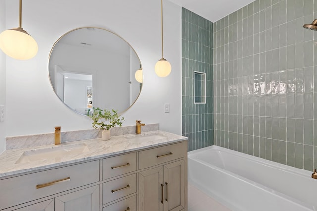 full bath with bathtub / shower combination, a sink, and double vanity