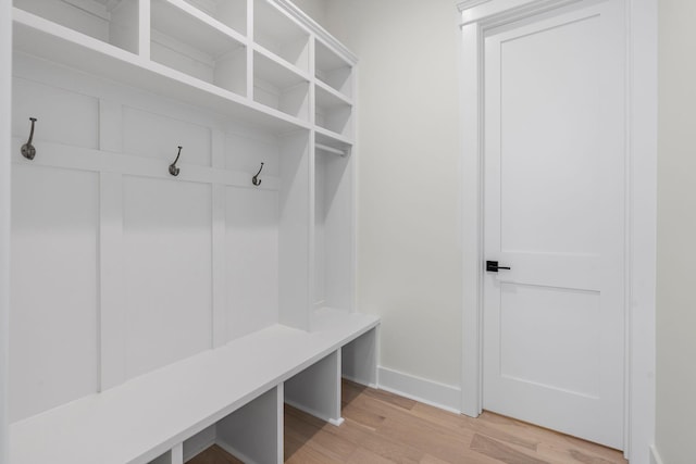 mudroom featuring light wood-style floors and baseboards