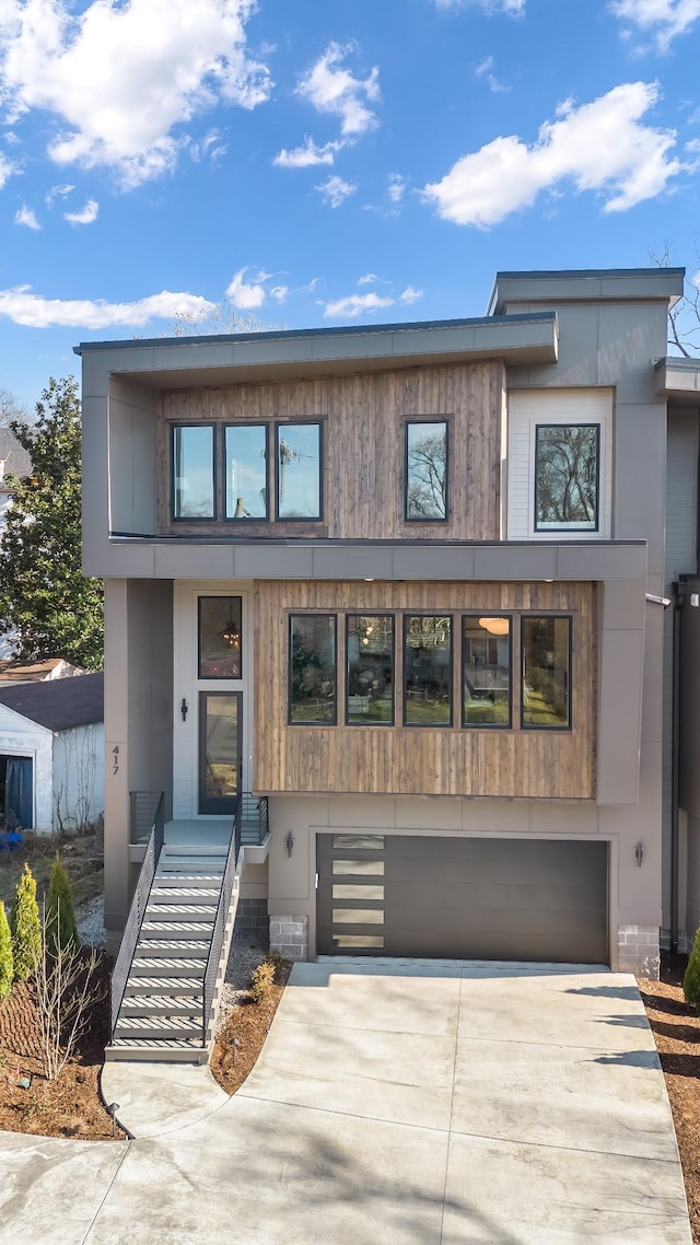 contemporary house featuring driveway and an attached garage