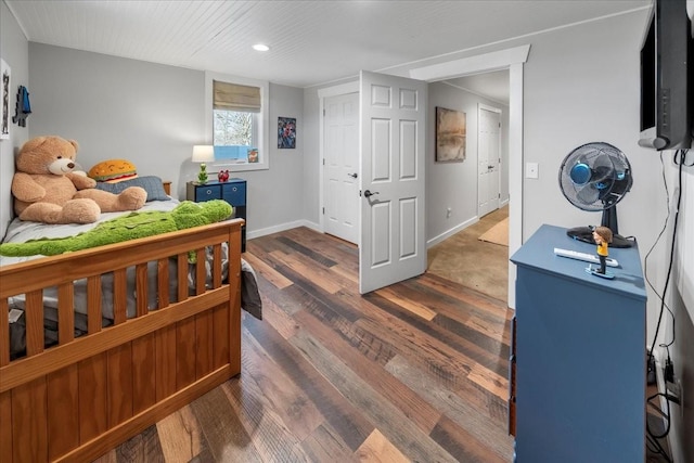 bedroom with baseboards and dark wood-style floors