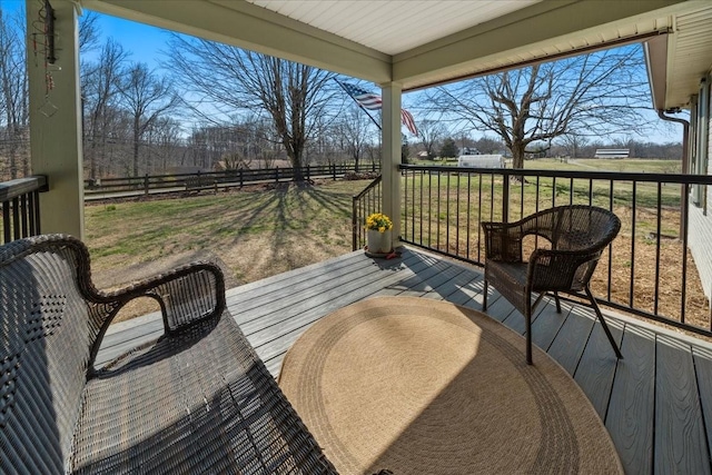 deck with outdoor dining space and fence