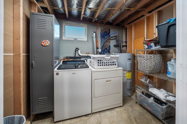 clothes washing area with water heater, laundry area, and independent washer and dryer