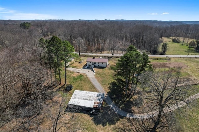 bird's eye view featuring a forest view and a rural view