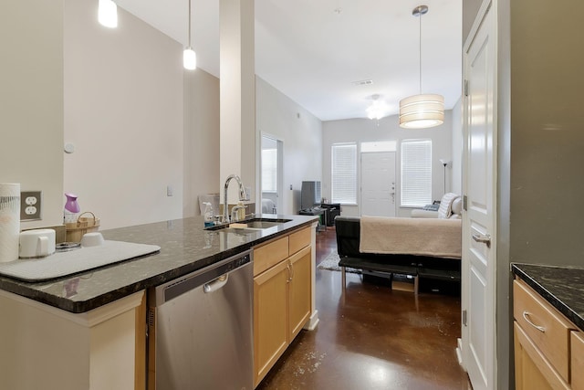 kitchen with concrete flooring, a sink, open floor plan, stainless steel dishwasher, and decorative light fixtures