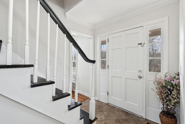 foyer with a healthy amount of sunlight and stairway