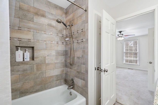 bathroom with shower / washtub combination and baseboards