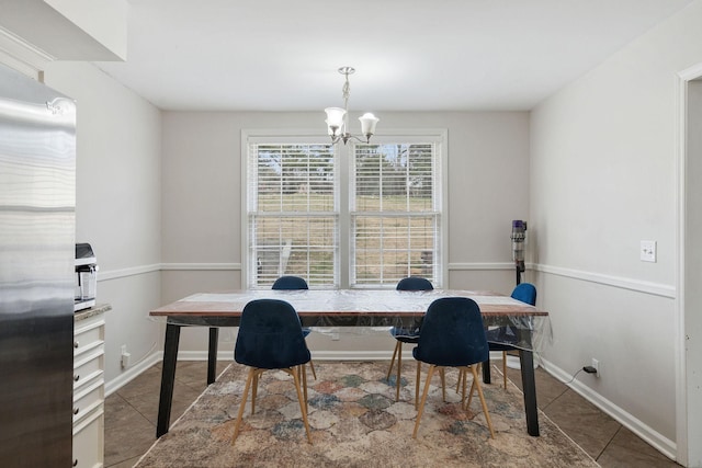 office space with tile patterned flooring, baseboards, and an inviting chandelier