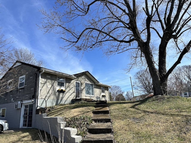 view of home's exterior featuring brick siding