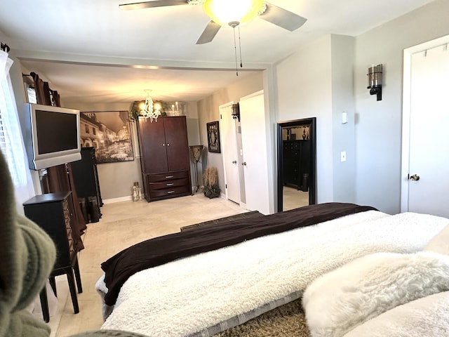 bedroom with light carpet, ceiling fan, and baseboards