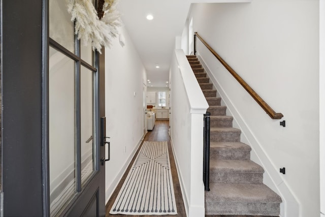 foyer entrance with stairs, recessed lighting, baseboards, and wood finished floors