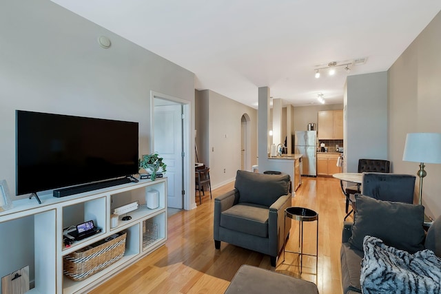 3000 Vanderbilt Pl Unit 323, Nashville, TN 37212 - living area with light wood-type flooring and arched walkways