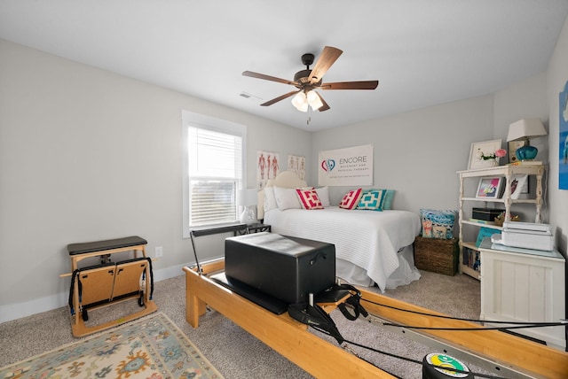 bedroom with visible vents, baseboards, and ceiling fan