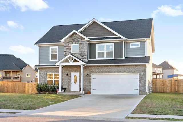 craftsman-style house featuring a garage, stone siding, fence, and driveway