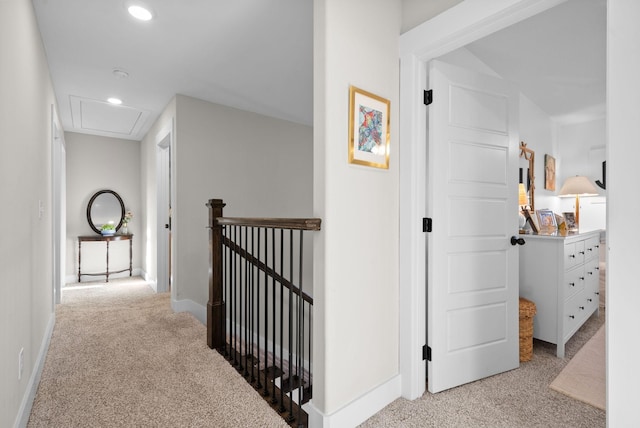 hall featuring attic access, baseboards, carpet, an upstairs landing, and recessed lighting