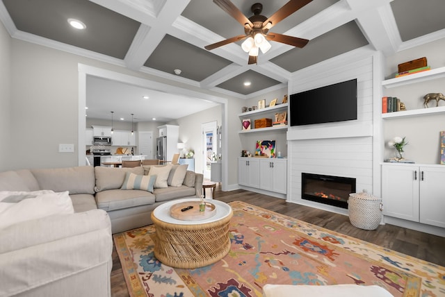 living room with coffered ceiling, dark wood-style flooring, crown molding, a fireplace, and recessed lighting