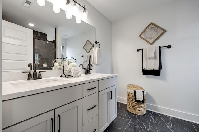 full bath featuring marble finish floor, visible vents, a sink, and a shower stall