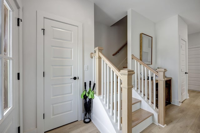 stairs with wood finished floors