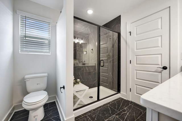 bathroom featuring toilet, marble finish floor, a marble finish shower, and baseboards