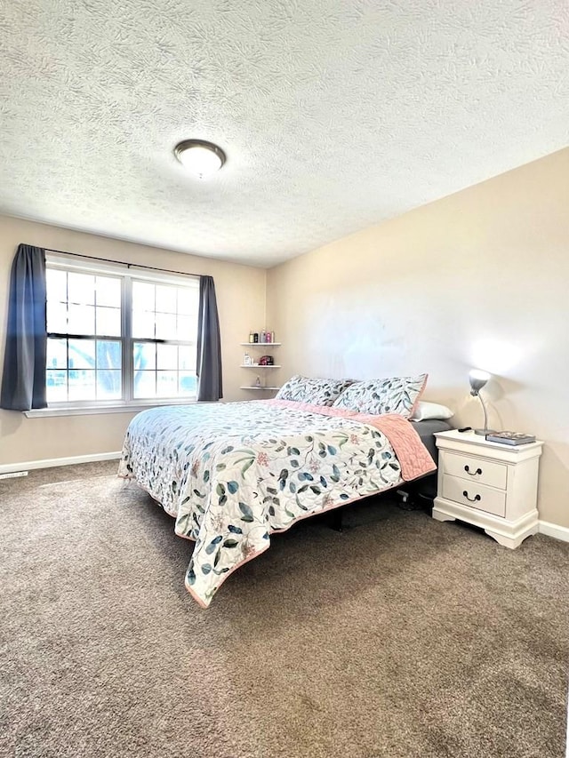 carpeted bedroom featuring baseboards