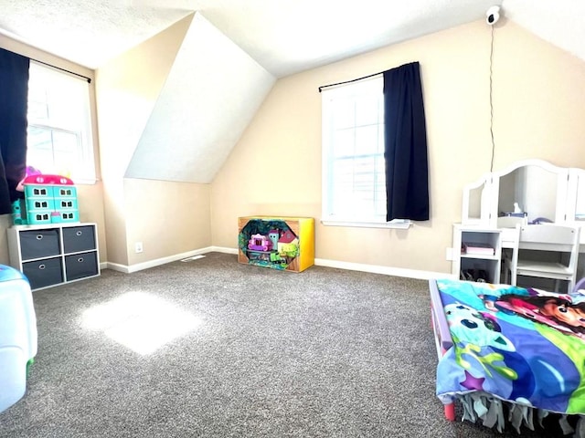 playroom with vaulted ceiling, carpet, and baseboards