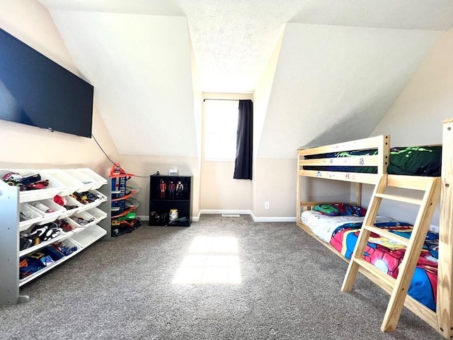 bedroom featuring a textured ceiling, vaulted ceiling, carpet flooring, and baseboards