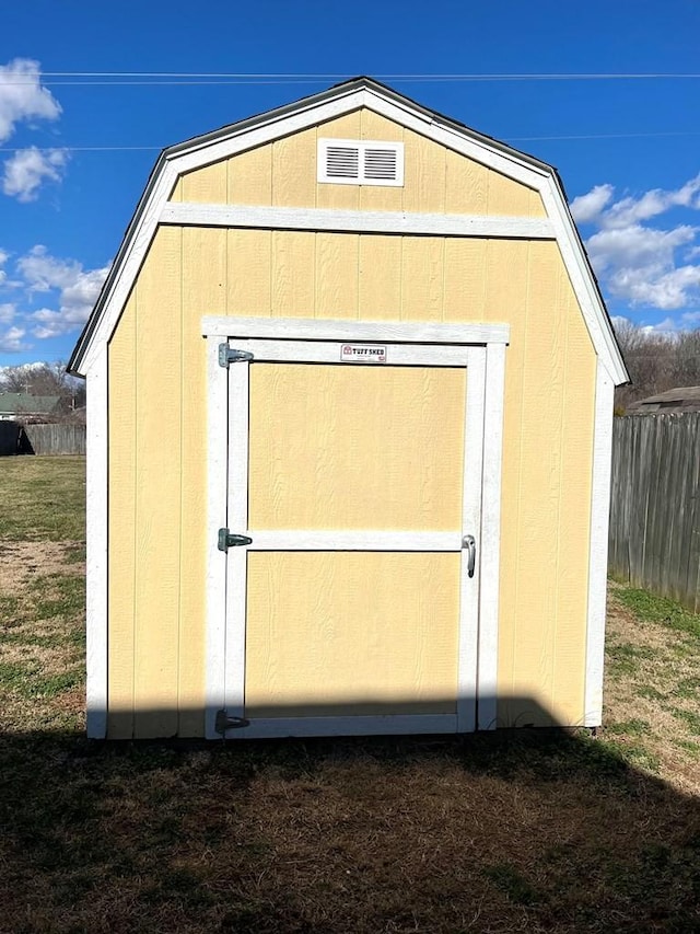 view of shed with fence