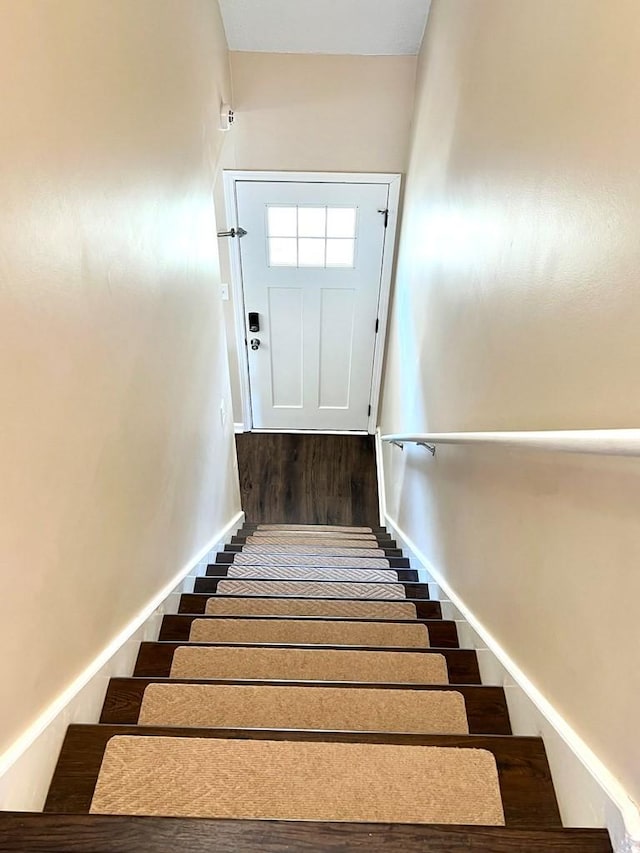 stairs featuring baseboards