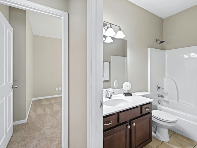 full bath with bathtub / shower combination, toilet, vanity, baseboards, and tile patterned floors