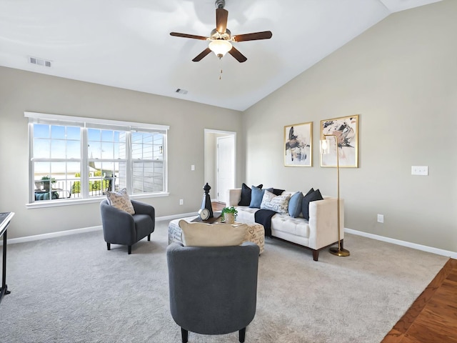 carpeted living room featuring high vaulted ceiling, visible vents, ceiling fan, and baseboards